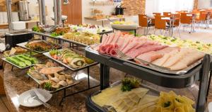 a buffet line with many different types of food at Ledan in Chłopy