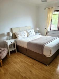 Postel nebo postele na pokoji v ubytování Grange House B&B