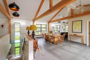 a kitchen and dining room with a table and chairs at Goodshelter Bay in Salcombe
