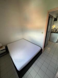 Ένα ή περισσότερα κρεβάτια σε δωμάτιο στο Frontignan plage vue mer et étang