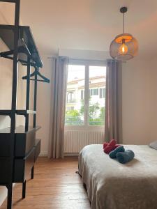 Posteľ alebo postele v izbe v ubytovaní Appartement charmant centre Biarritz