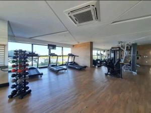 a gym with treadmills and machines in a room at BHF》1107•Conforto e tranquilidade. Flat beira mar! in Recife