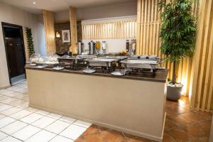 Kuchyňa alebo kuchynka v ubytovaní Votsalakia Hotel & Luxury Apartments