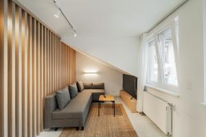 Posezení v ubytování Zeus Design Apartmenthaus