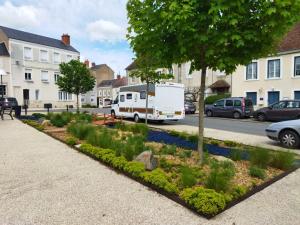 an rv parked on the side of a street at Le Chapitre in Châteaumeillant