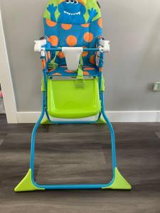 a childs high chair with a drink in it at Travel, Work, Play- alone, family, friends in Mount Prospect