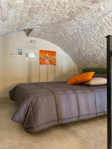 a large bed in a room with a ceiling at Casa Melina! Historic house in Locorotondo in Locorotondo