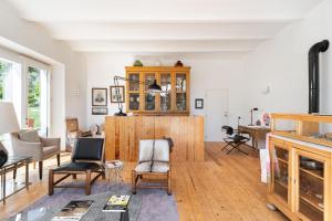 a living room with wooden furniture and a table at Imani Country House in Évora