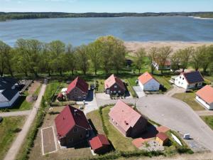 an aerial view of a house with a lake at AlleenHuus in Warin