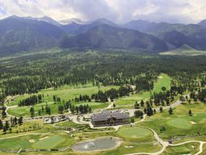 an aerial view of a golf course with mountains in the background at Discovery Apartment Bansko in Bansko