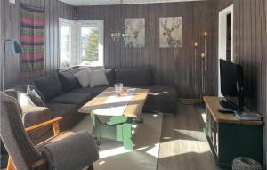 a living room with a couch and a table at Beautiful Home In Etnedal With Wifi And 2 Bedrooms in Fagernes