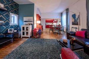 a living room with a couch and a table at H11 COUNTRY LUX - Sanremo - Garden in Sanremo +21 photos