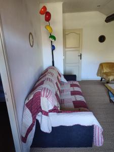 a bed with a blanket on it in a room at Abondance in Valdeblore