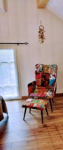 A seating area at Chambre d hôtes avec 2 petits déjeuners ou Gîte