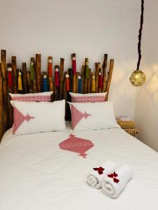 a bedroom with a bed with towels on it at Riad Tsar Mimoun in Marrakesh