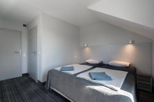 Łóżko lub łóżka w pokoju w obiekcie PIONOW Pokoje Hotelowe - adults only