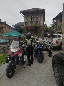 two motorcycles parked in front of a house at Golden Gate in Akhaltsikhe