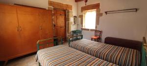 Ένα ή περισσότερα κρεβάτια σε δωμάτιο στο Irene's Guest House