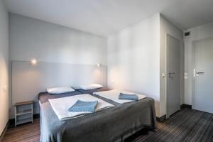 Łóżko lub łóżka w pokoju w obiekcie PIONOW Pokoje Hotelowe - adults only
