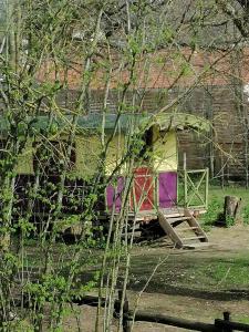 a play house with a slide in a yard at Balad'âne in Flachères