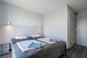 Łóżko lub łóżka w pokoju w obiekcie PIONOW Pokoje Hotelowe - adults only