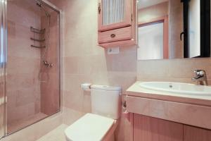 a bathroom with a toilet and a sink and a shower at La Puerta del Mar - Alicante in Alicante