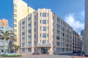 a large white building with a sign on it at Marlborough apartment 509 in Durban