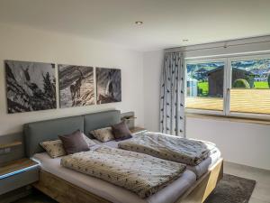 Postel nebo postele na pokoji v ubytování Ferienhaus Lochner
