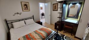 A bed or beds in a room at Flora's Boutique Apartment at the heart of Corfu