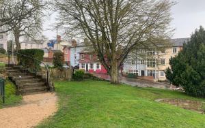 a park with stairs and houses on a street at The Red House Maldon in Maldon