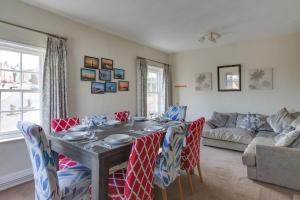 a dining room with a table and chairs at The Red House Maldon in Maldon +15 photos