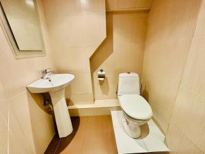 a small bathroom with a toilet and a sink at Arshakunyats 88 TopHouse in Yerevan