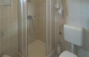 a bathroom with a shower and a toilet at Lovely Apartment In Martinscica With House Sea View in Martinšćica