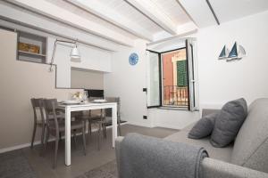 a living room with a couch and a table at Vista sul Borgo in Varazze