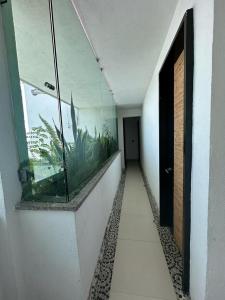 a hallway with a fish tank on the wall at Isla vancouber in Acapulco