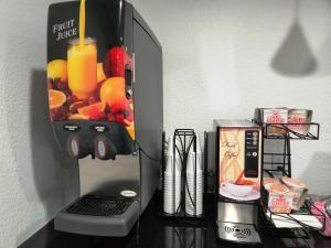 a refrigerator with a picture of fruit on the side of it at Express Inn Tomball in Tomball