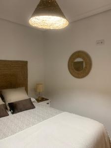 Postel nebo postele na pokoji v ubytování El Encanto de Abadía