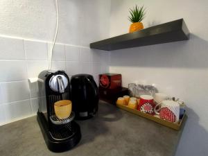 a coffee maker on a counter in a kitchen at Casa Hóspedes Polido in Termas de Sao Pedro do Sul