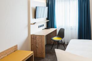 Postel nebo postele na pokoji v ubytování Hotel Rad