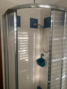 a shower with a shower head in a bathroom at Lovely Marinella in Marinella di Sarzana