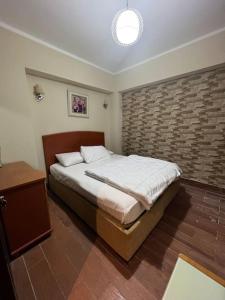 A bed or beds in a room at بورتو مارينا الساحل الشمالى