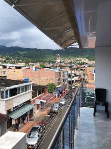 a view of a city from the balcony of a building at APARTAMENTO FULL HOUSE con BALCON in El Colegio +3 photos