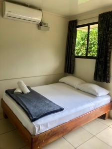 Postel nebo postele na pokoji v ubytování Le Petit Hotel
