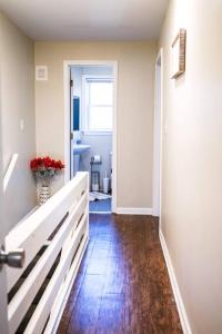 a hallway of a home with a door and a room with a hallway at 3 bedroom comfy RVA in Richmond