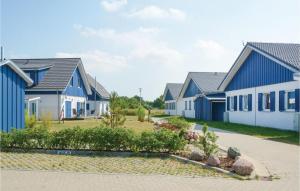 a row of houses with blue and white at Ferienhaus 13 Altefhr in Altefähr