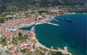 an aerial view of a city and a harbor at 1 Bedroom Beautiful Apartment In Martinscica in Martinšćica