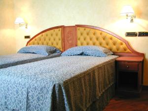 Postel nebo postele na pokoji v ubytování Hotel Antico Masetto + 22 fotografií