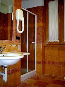 Ванна кімната в Hotel Antico Masetto