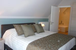 Postel nebo postele na pokoji v ubytování B&B Riche Terre