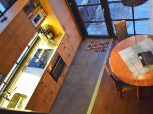 an overhead view of a kitchen and dining room with a table at Holiday home SÄLEN in Stöten